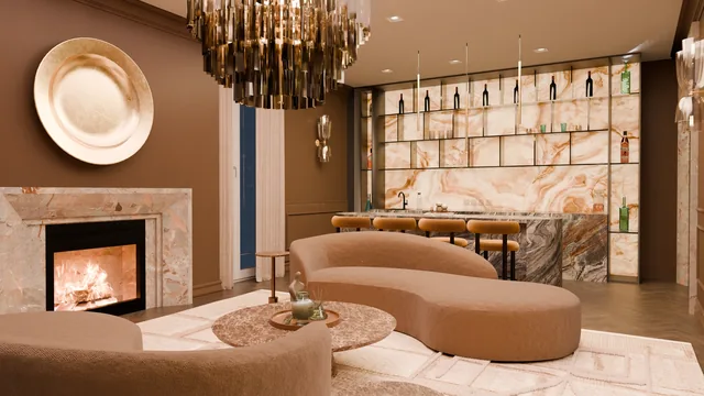 Lounge with curved seating, a marble fireplace and an illuminated bar